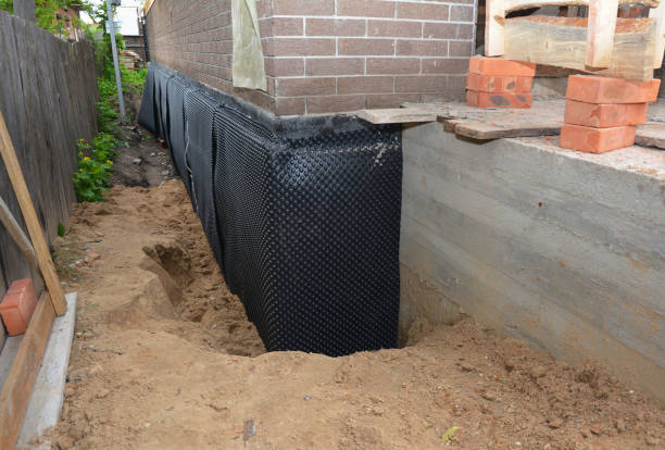 Happy homeowners after waterproofing job in Eatontown